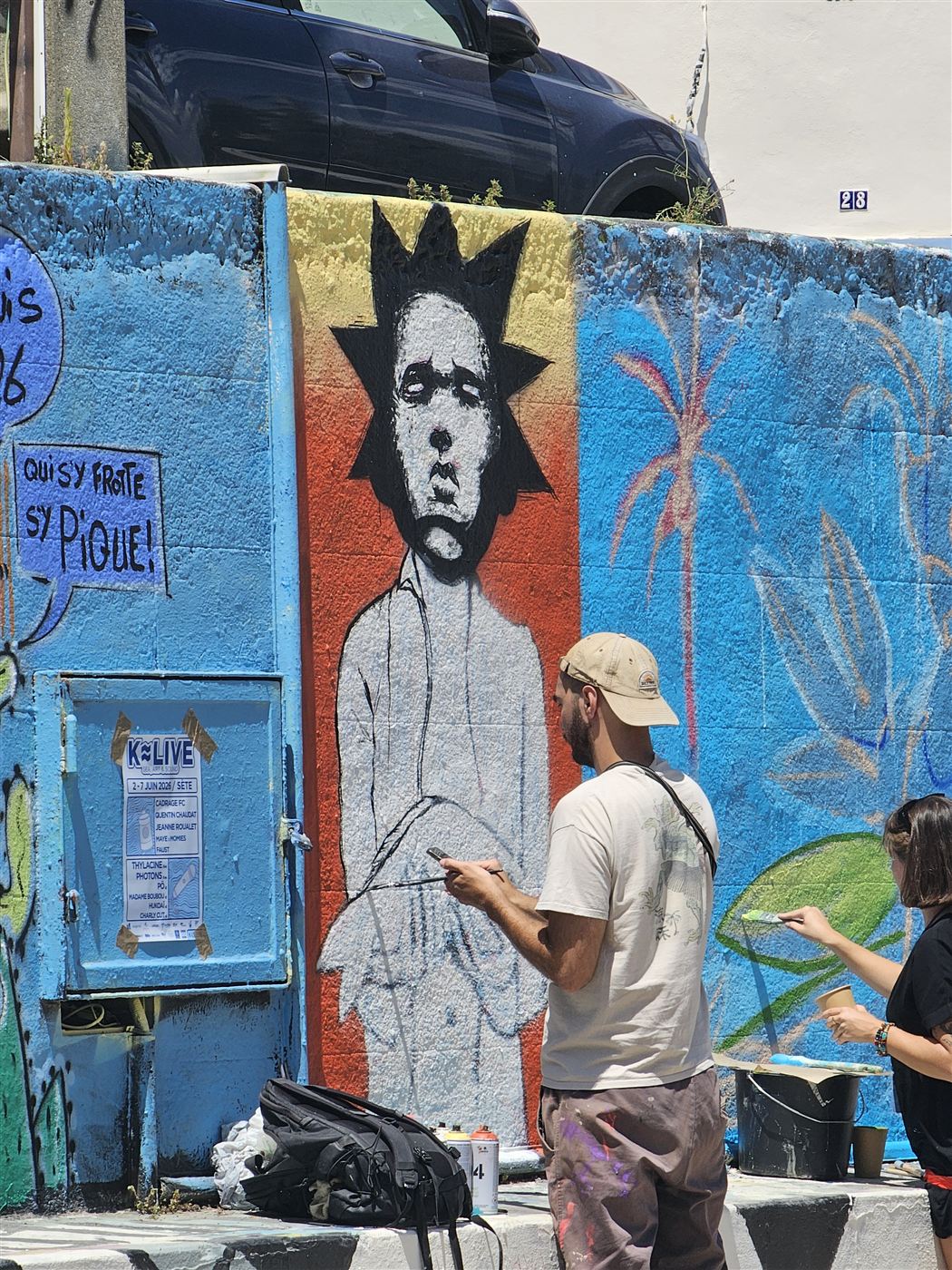 Artiste peignant un portrait lors du Street Art Jam 2026